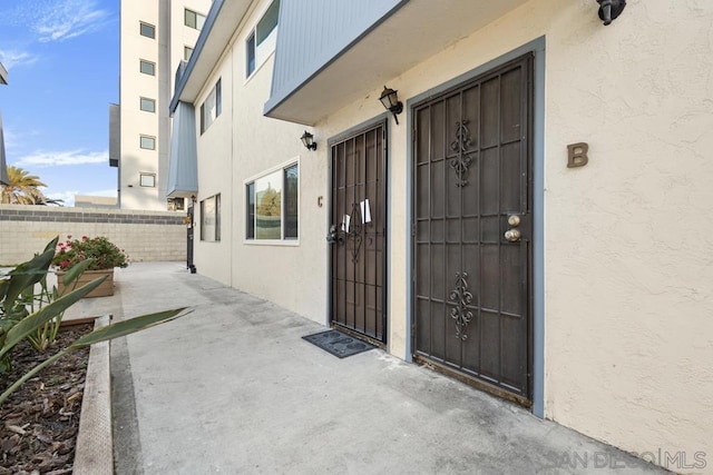 doorway to property featuring a patio area