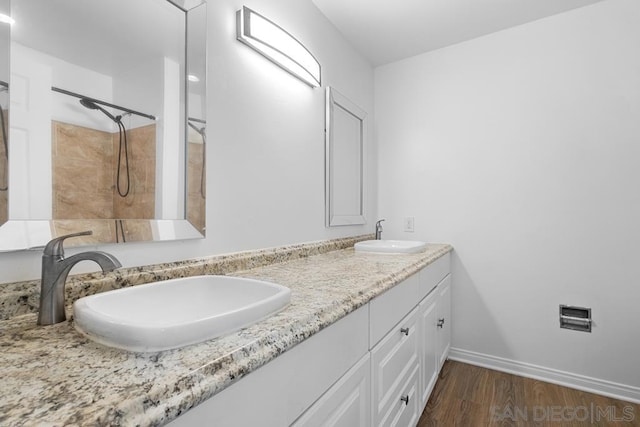 bathroom with vanity and wood-type flooring