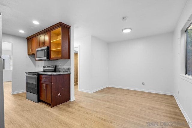 kitchen with light hardwood / wood-style flooring and stainless steel appliances