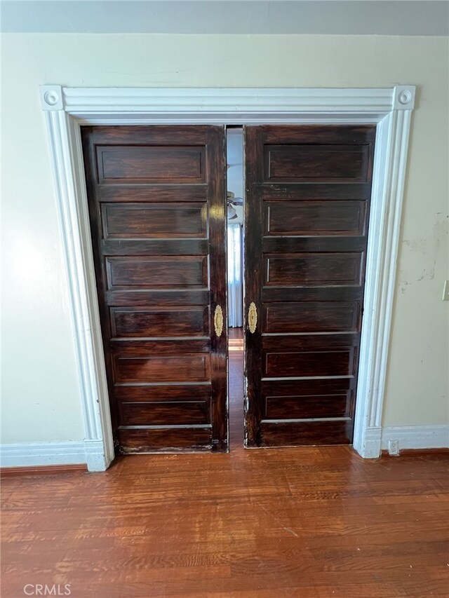 interior details featuring hardwood / wood-style flooring