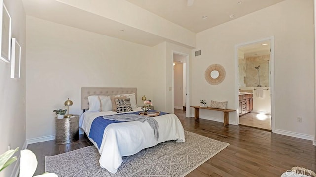 bedroom featuring ensuite bathroom, ceiling fan, and dark wood-type flooring