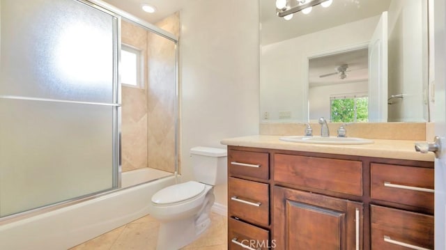 full bathroom featuring ceiling fan, tile patterned flooring, enclosed tub / shower combo, toilet, and vanity