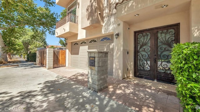 doorway to property with french doors and a balcony