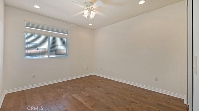 unfurnished room featuring dark hardwood / wood-style flooring and ceiling fan