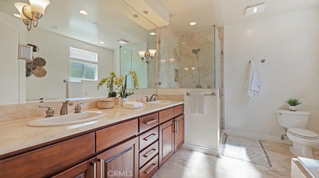 bathroom featuring tile patterned floors, vanity, an enclosed shower, and toilet