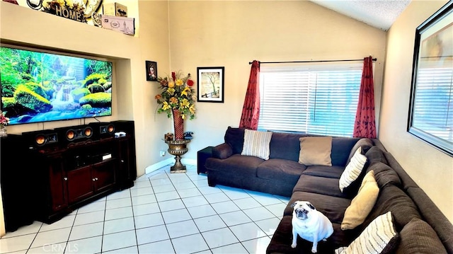 living room featuring light tile patterned floors and vaulted ceiling