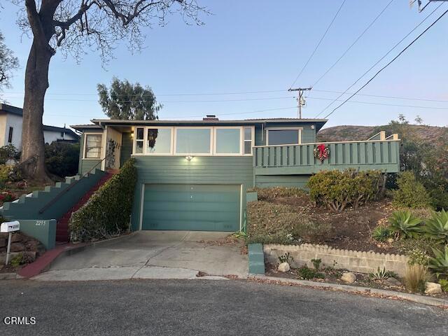 view of front of property with a garage