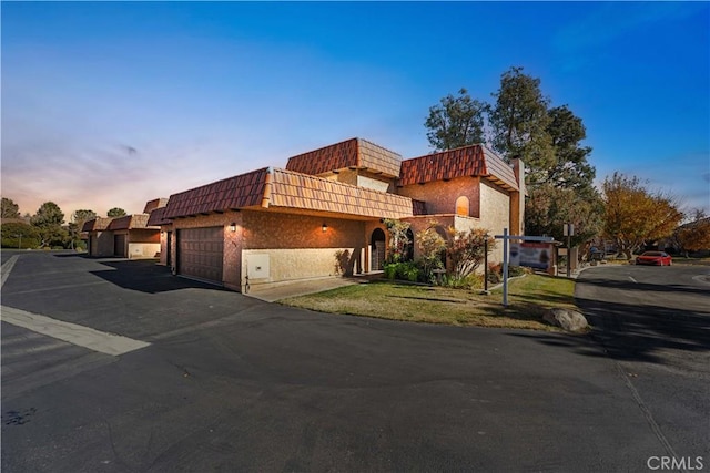 mediterranean / spanish-style house featuring a garage