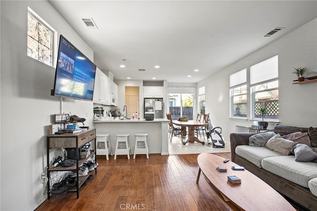 living room featuring dark hardwood / wood-style floors