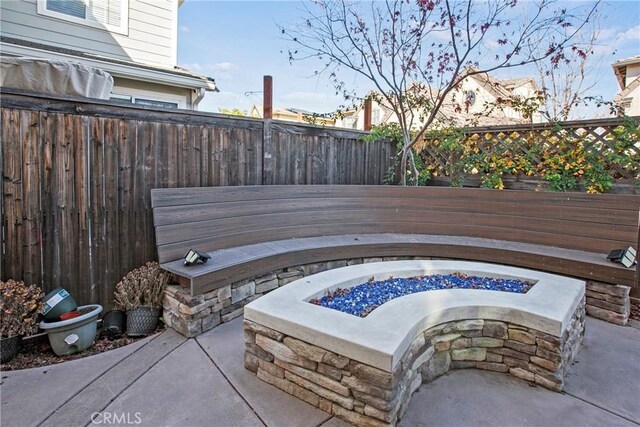 view of patio with an outdoor fire pit