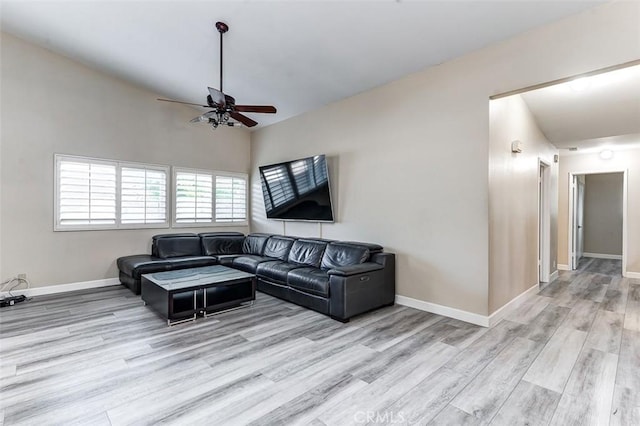 living room with ceiling fan and light hardwood / wood-style floors