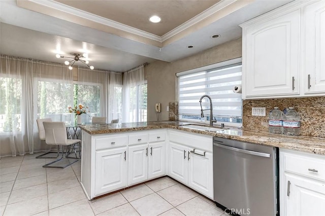 kitchen featuring kitchen peninsula, light stone counters, crown molding, dishwasher, and white cabinetry