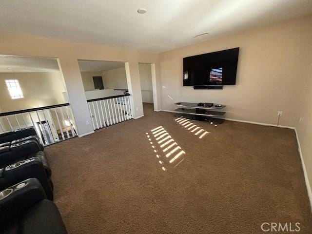 living room featuring dark colored carpet