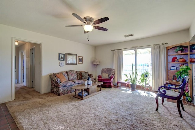 living room featuring ceiling fan and carpet floors