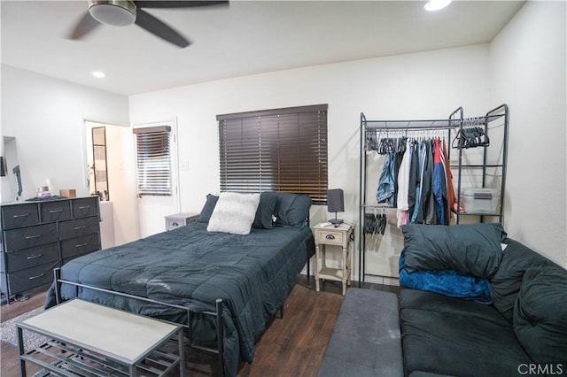 bedroom featuring ceiling fan and dark hardwood / wood-style floors