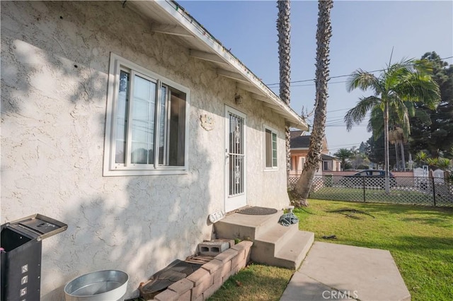 view of property exterior with a yard