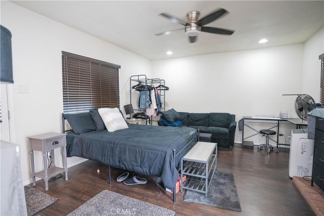 bedroom with ceiling fan and dark hardwood / wood-style flooring