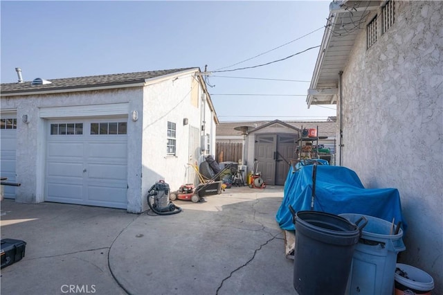 view of side of property featuring a shed