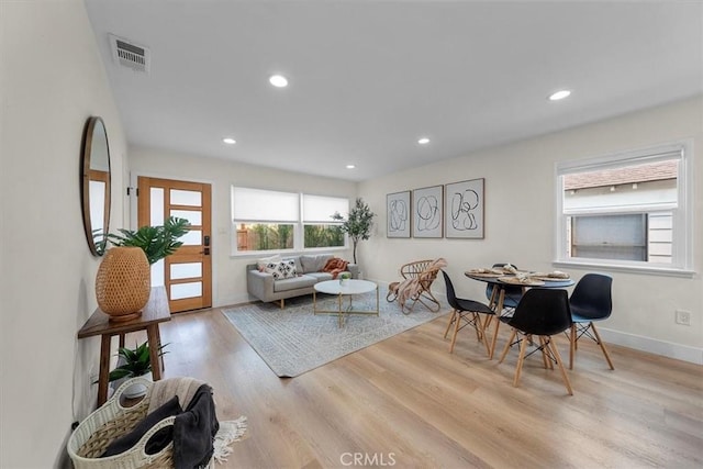 dining area with light hardwood / wood-style floors