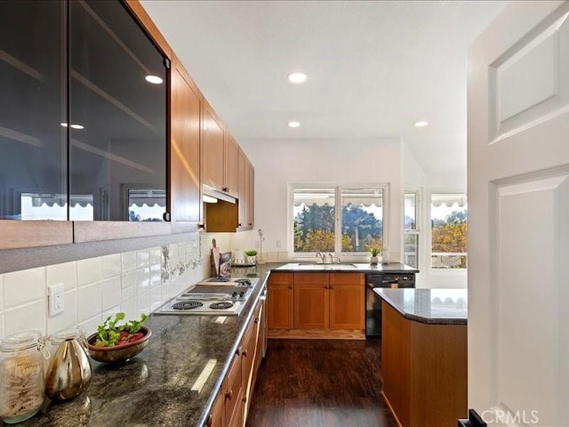 kitchen with sink, black dishwasher, tasteful backsplash, stainless steel gas cooktop, and dark hardwood / wood-style floors