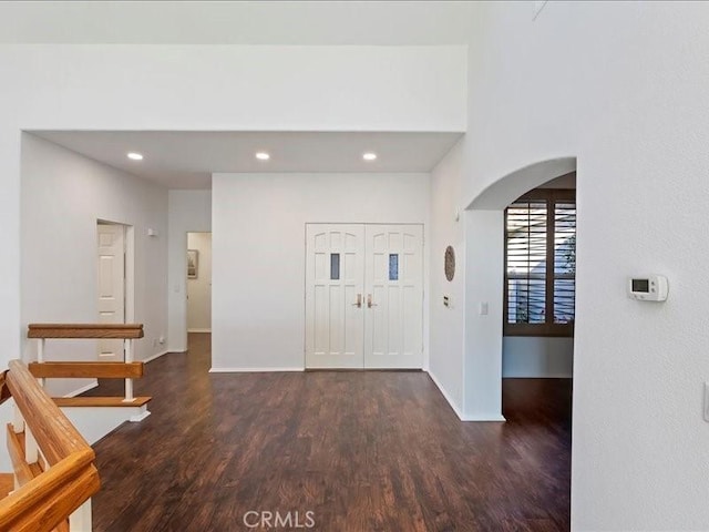 entrance foyer with dark hardwood / wood-style floors