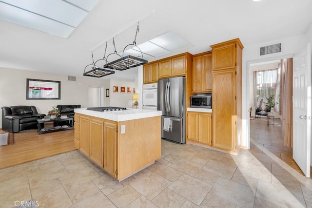 kitchen with stainless steel appliances and a center island