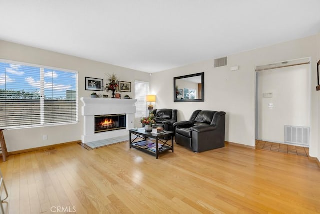 living room with light hardwood / wood-style floors