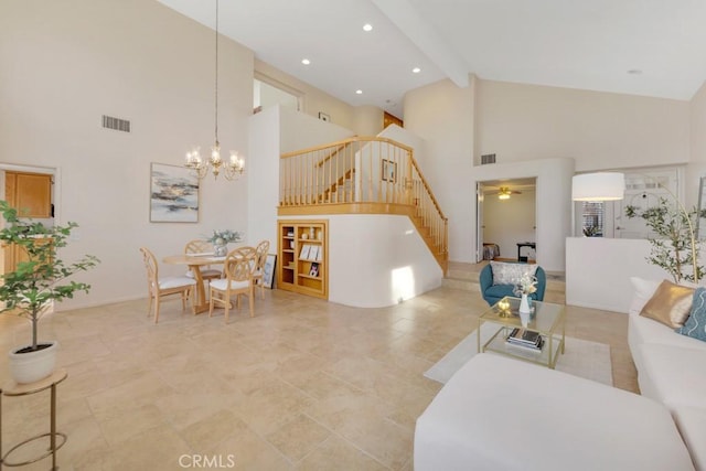 living room featuring ceiling fan with notable chandelier, high vaulted ceiling, and beamed ceiling