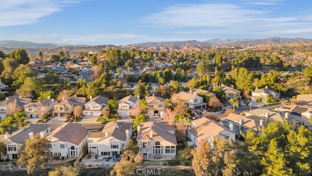 birds eye view of property featuring a mountain view