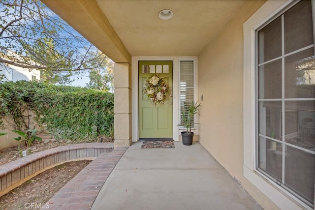 property entrance with a patio area