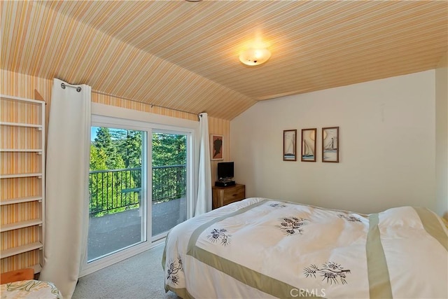 carpeted bedroom with access to outside and lofted ceiling