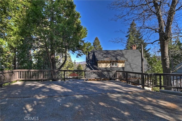 view of home's exterior with a wooden deck