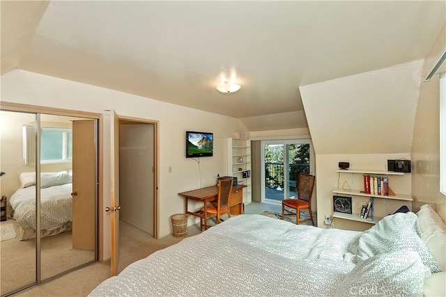 carpeted bedroom featuring access to outside and vaulted ceiling