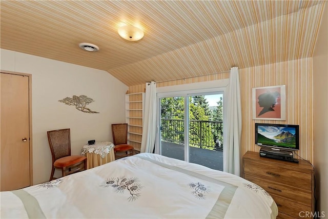 bedroom with access to outside and lofted ceiling