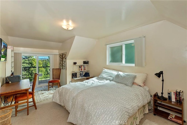 carpeted bedroom featuring access to outside and vaulted ceiling