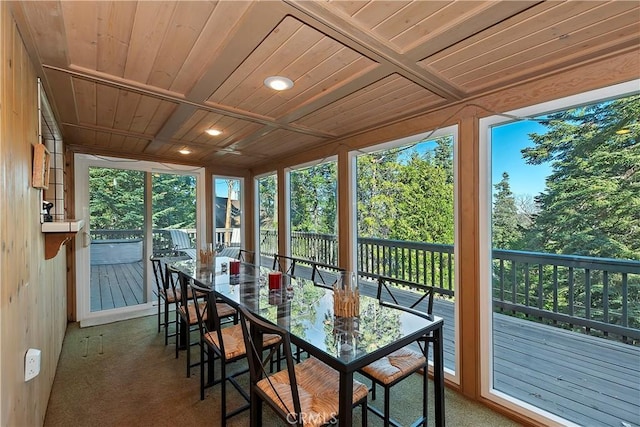 sunroom / solarium with plenty of natural light and wooden ceiling