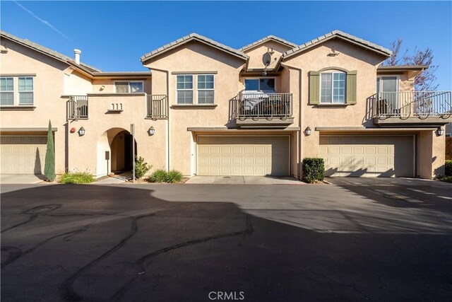 multi unit property featuring a balcony