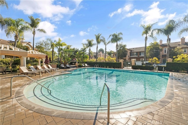 view of swimming pool with a patio