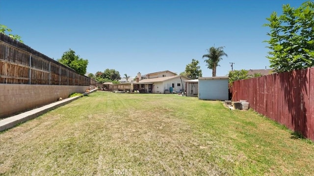 145 Carlota Way, Riverside, CA 92507 - fenced backyard with a storage unit