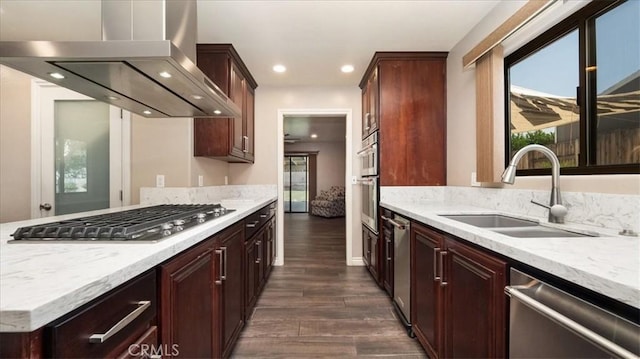 145 Carlota Way, Riverside, CA 92507 - kitchen with appliances with stainless steel finishes, wall chimney exhaust hood, dark wood-type flooring, recessed lighting, and light stone counters