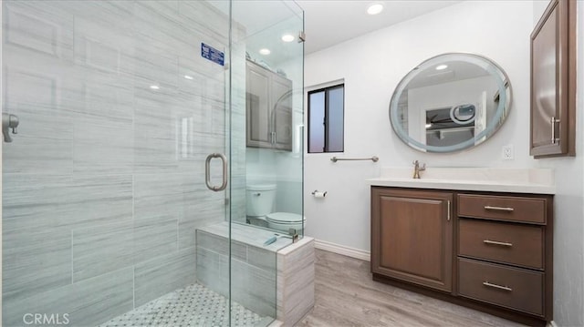 145 Carlota Way, Riverside, CA 92507 - bathroom with vanity, a shower stall, recessed lighting, and wood finished floors