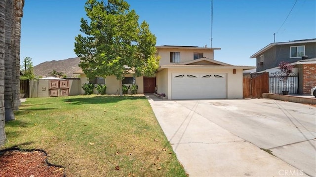 145 Carlota Way, Riverside, CA 92507 - view of front of house featuring stucco siding, a garage, concrete driveway, and a mountain view
