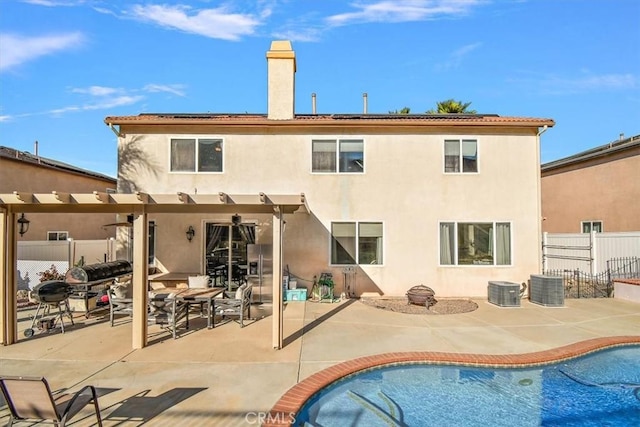 rear view of property featuring a patio area, a pergola, and central air condition unit