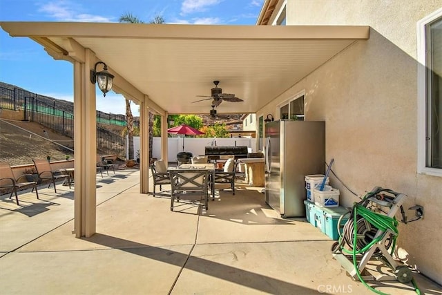 view of patio featuring ceiling fan