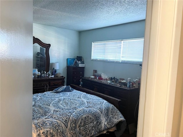 bedroom featuring a textured ceiling