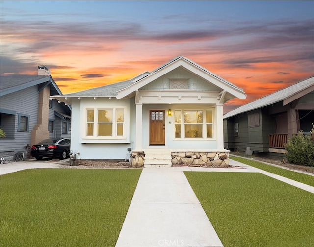 view of front of home with a lawn