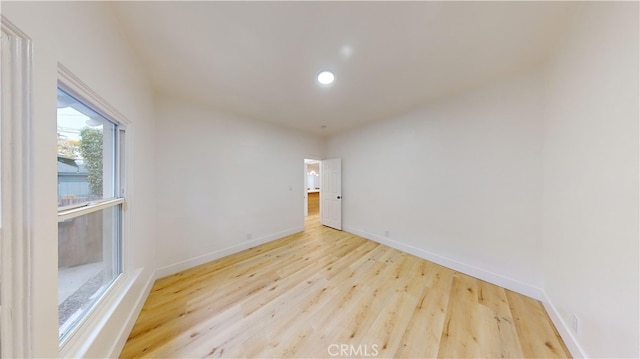 spare room with light hardwood / wood-style flooring