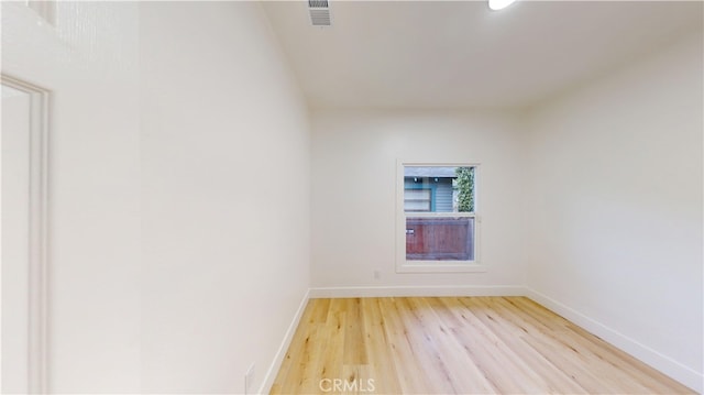 spare room with light hardwood / wood-style floors