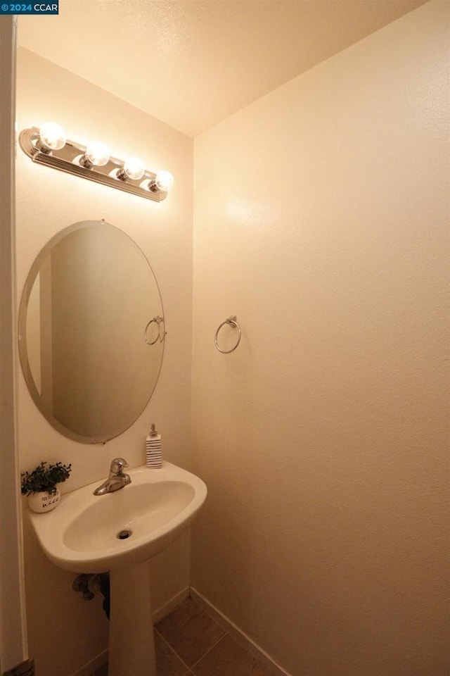 bathroom with tile patterned flooring