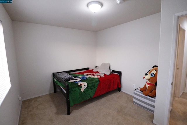 bedroom with light colored carpet